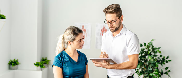 woman and dr talking in a clinic treatment room